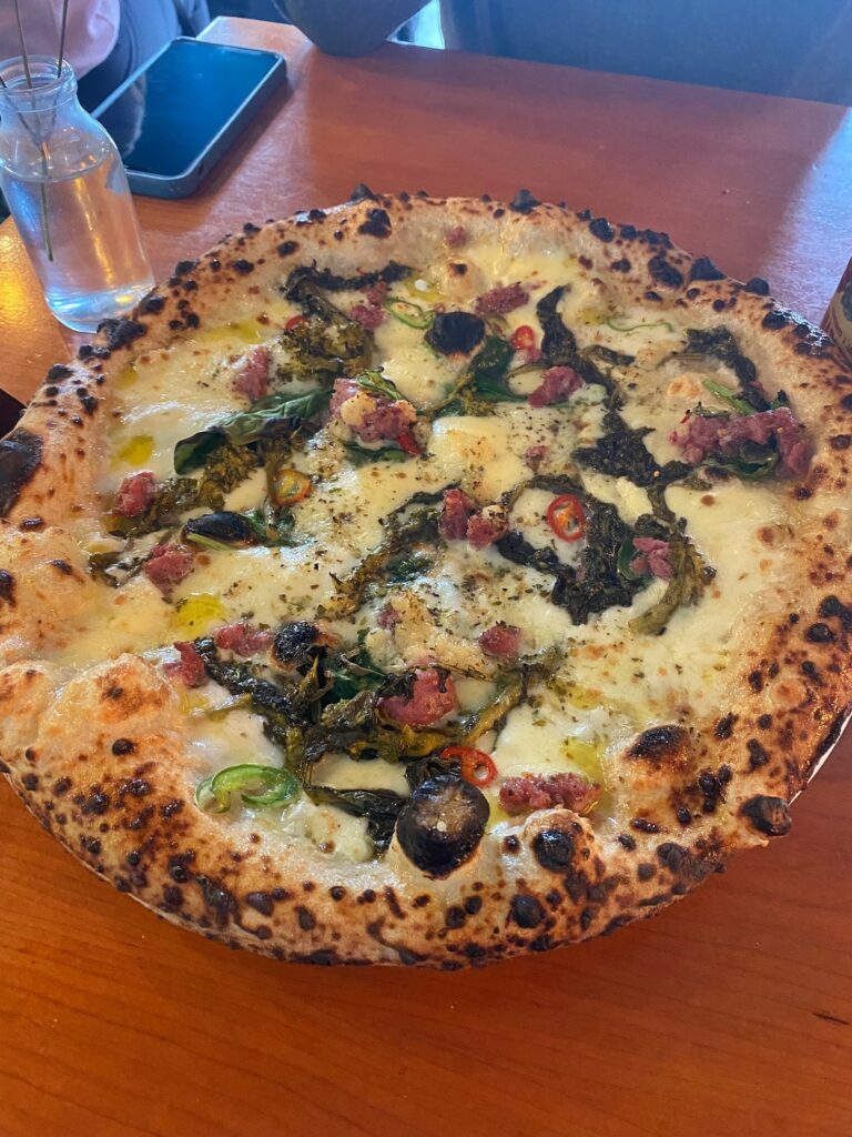 White pizza with wood roast fennel sausage and broccoli rabe, chilli, garlic and oregano