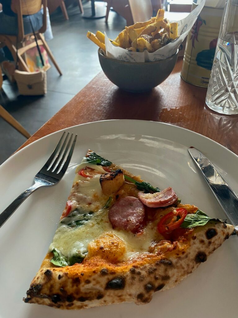 Smoked sausage, spinach, potato and chilli pizza with a side of Compania fries